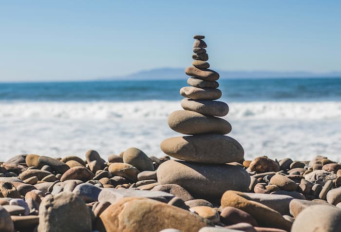 Photo by Jeremy Thomas on Unsplash A rock cairn
