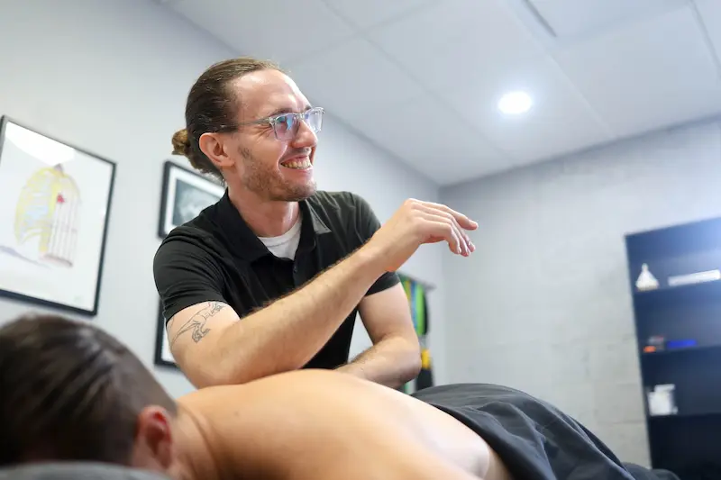 a patient recieving dry needle treatment in back
